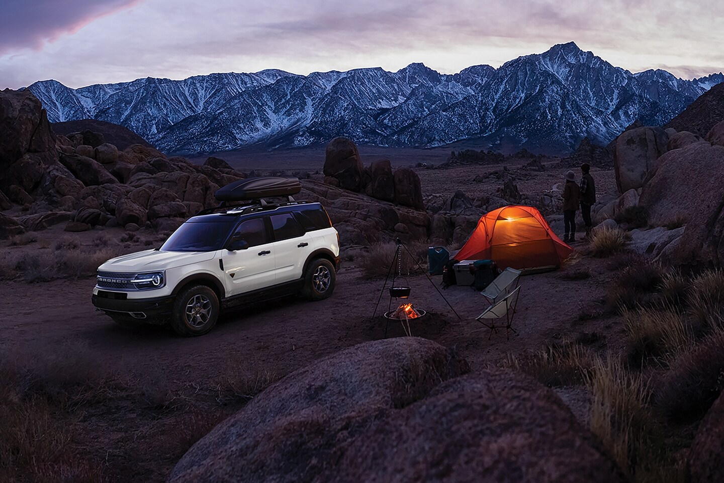 2024 Ford Bronco Sport parked in the mountains next to people camping
