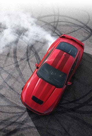 Overhead view of a 2024 Ford Mustang® model with tire tracks on pavement | Serra Ford Rochester Hills in Rochester Hills MI