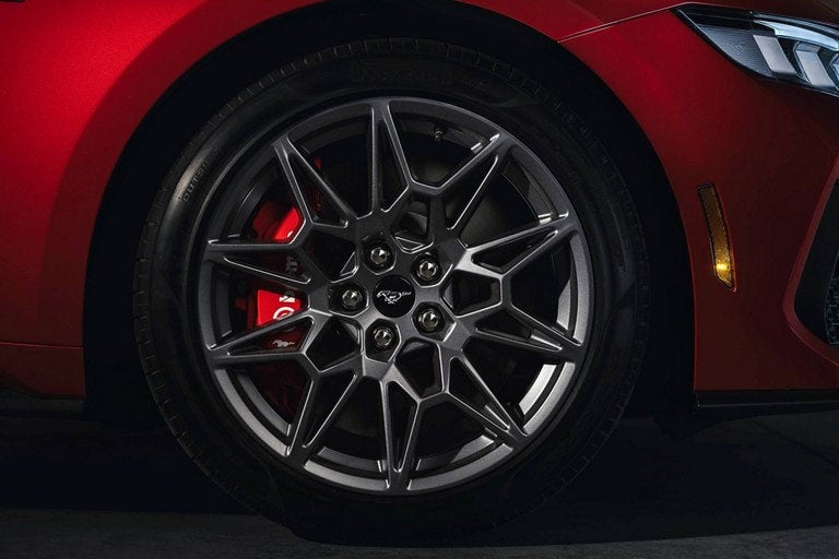 2024 Ford Mustang® model with a close-up of a wheel and brake caliper | Serra Ford Rochester Hills in Rochester Hills MI