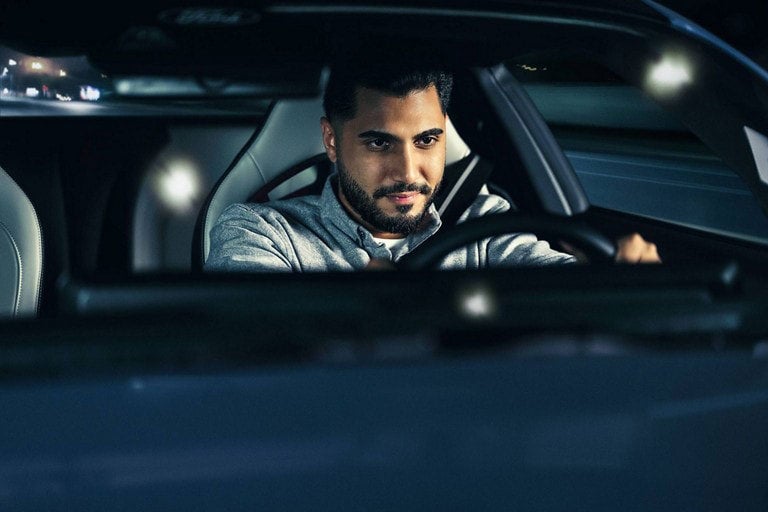 Person sitting in the driver’s seat of a parked 2024 Ford Mustang® coupe | Serra Ford Rochester Hills in Rochester Hills MI