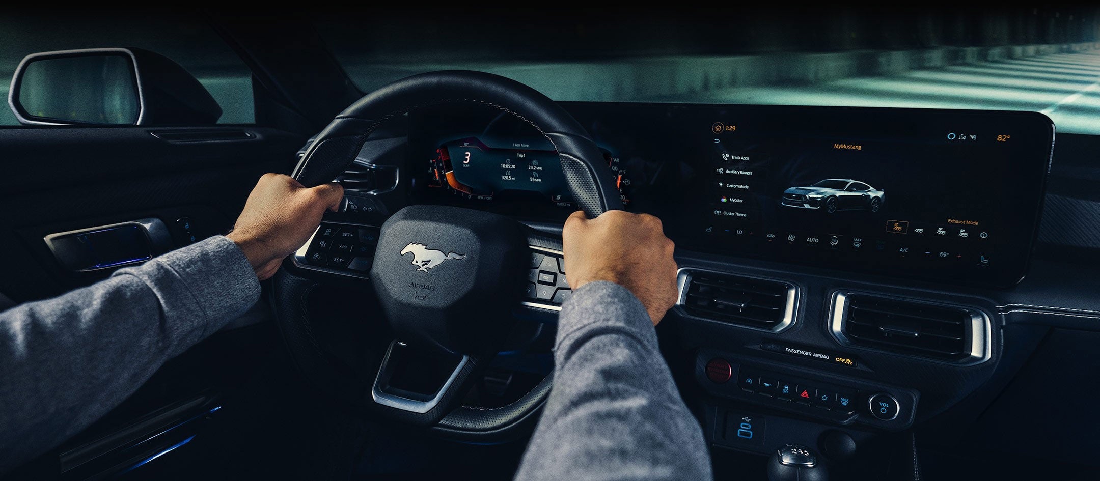 A 2024 Ford Mustang® model interior with a person driving | Serra Ford Rochester Hills in Rochester Hills MI